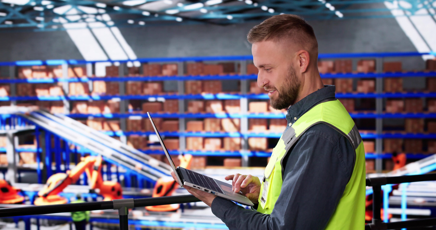 Worker in a logistic warehouse doing strategic forecasting and optimizing inventory and fulfillment